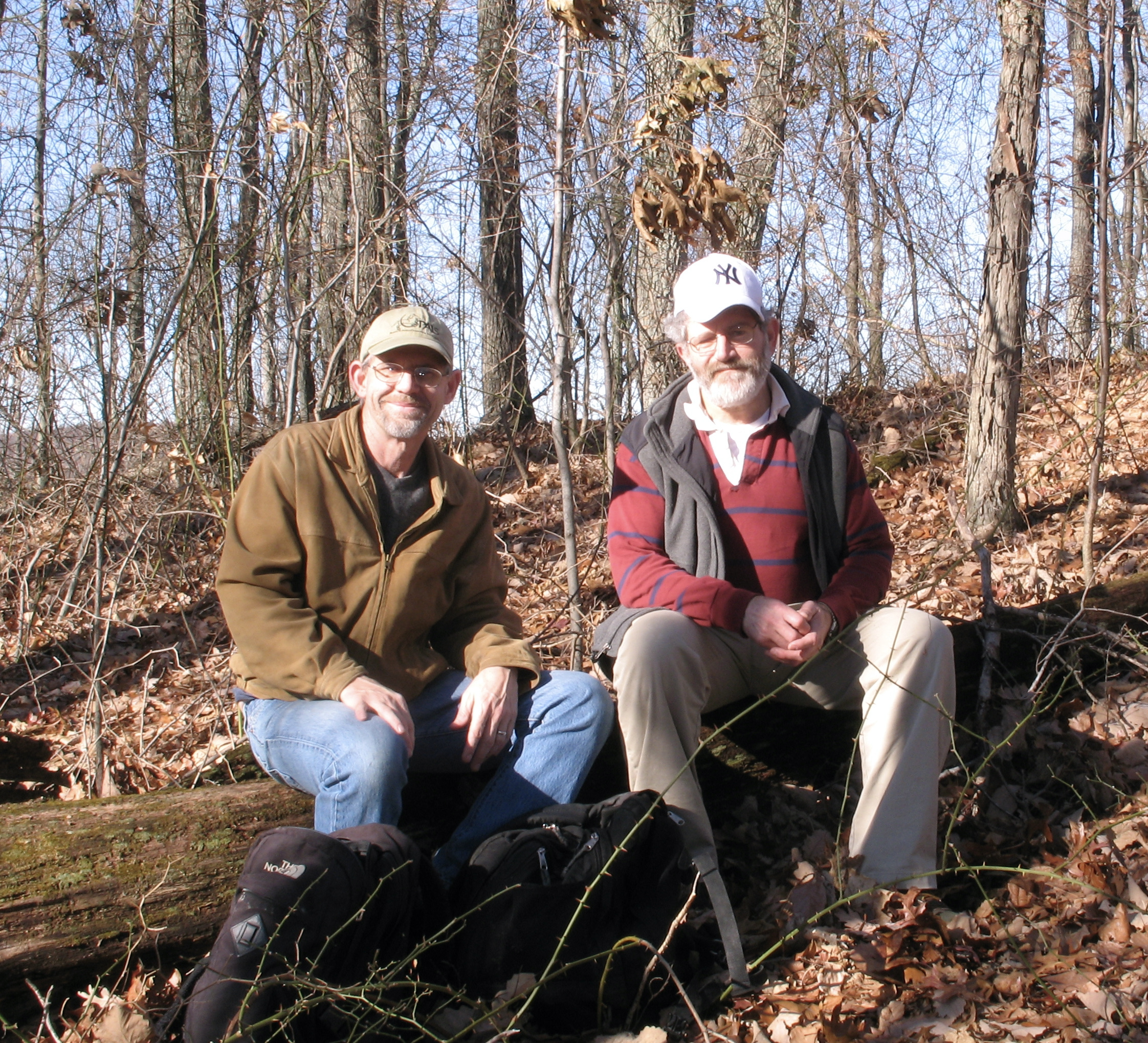 Eric & Peter on a log in the woods